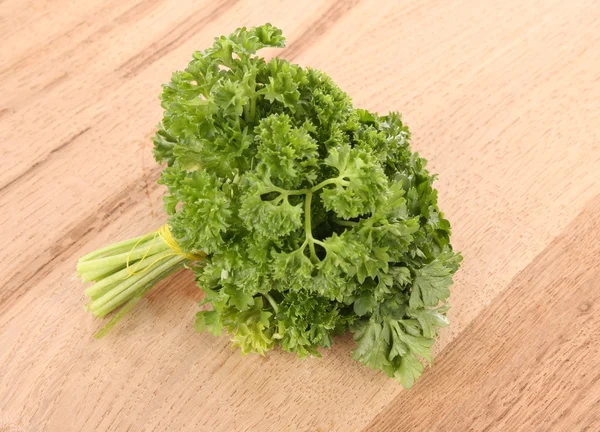Bouquet of parsley on wooden background — Stock Photo, Image