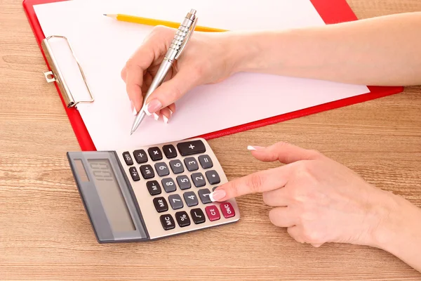 Writing and calculator — Stock Photo, Image