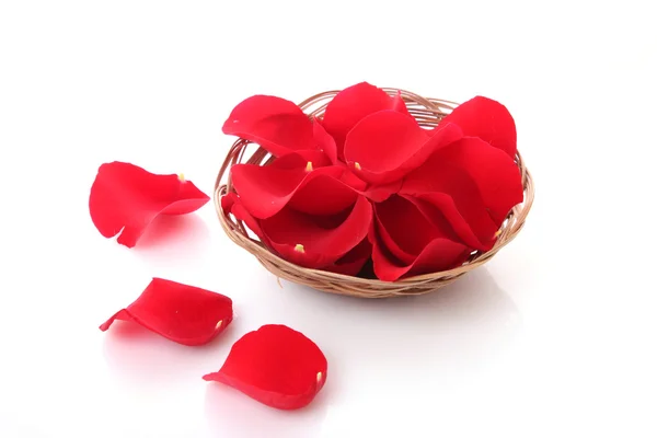 Basket with red roses petals — Stock Photo, Image