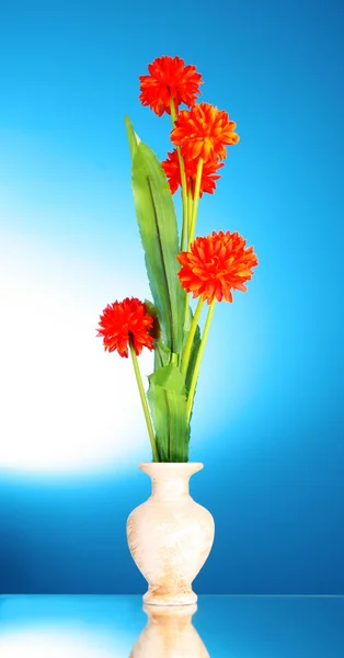 Orange flowers in a vase — Stock Photo, Image