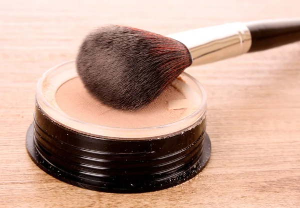 Cosmetic brush and powder Stock Image