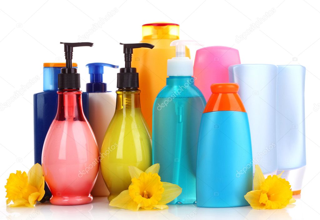 Bottles of health and beauty products on white background