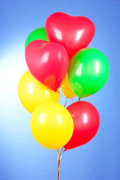Flying balloons on a blue background — Stock Photo, Image
