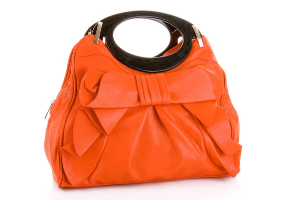 Оранжевый женский мешок на белом фоне — стоковое фото