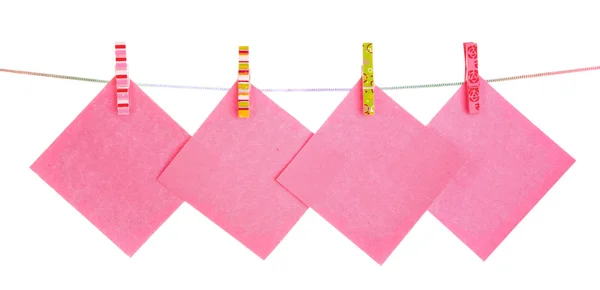Blank paper sheets on a clothes line on a white background — Stock Photo, Image
