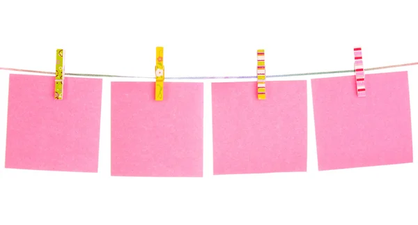 Blank paper sheets on a clothes line on a white background — Stock Photo, Image