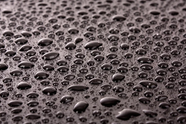 Water drops on black — Stock Photo, Image