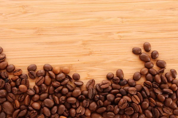 Coffee beans on brown background — Stock Photo, Image