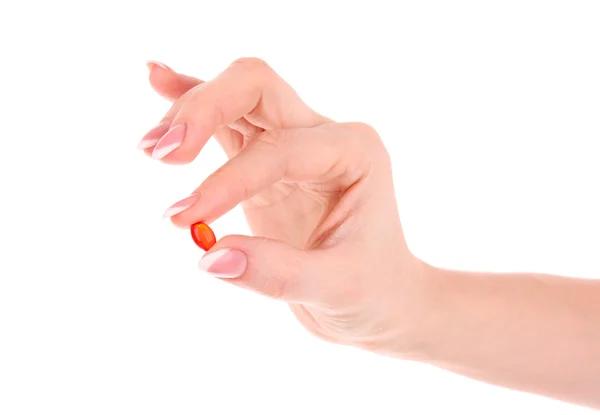 Cápsula de vitamina E na mão sobre um fundo branco — Fotografia de Stock