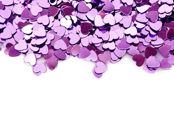 Violet hearts in the form of confetti on white — Stock Photo, Image