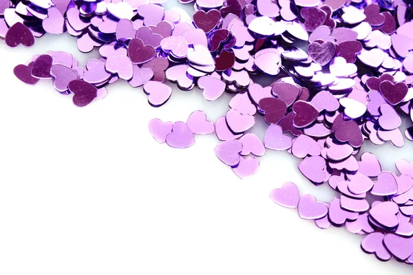 Corazones violetas en forma de confeti sobre blanco — Foto de Stock
