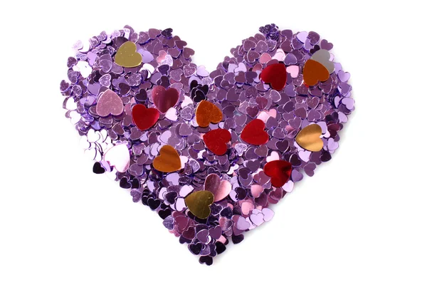 Фиолетовые сердца в форме конфетти на белом — стоковое фото