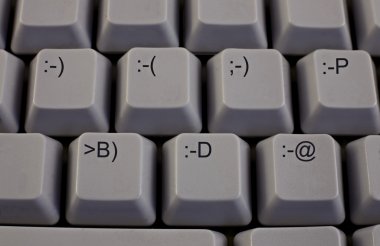 Computer keybord with emoticons clipart