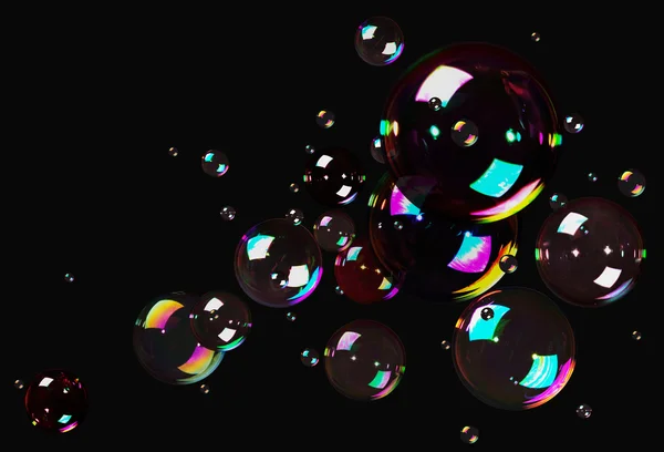 Мыльные пузыри на черном — стоковое фото