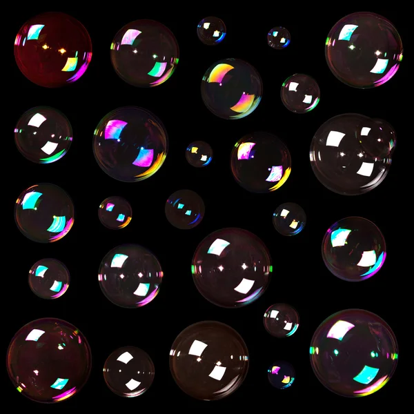 Мыльные пузыри на черном — стоковое фото