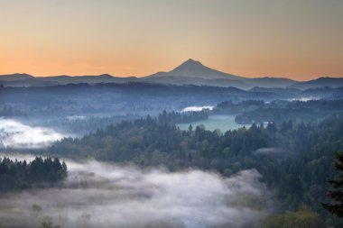 Foggy Sunrise Over Sandy River and Mount Hood clipart