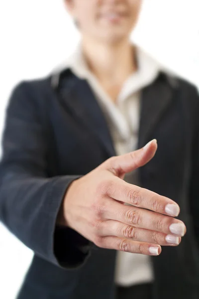 Businesswoman giving hand for handshake — Stock Photo, Image