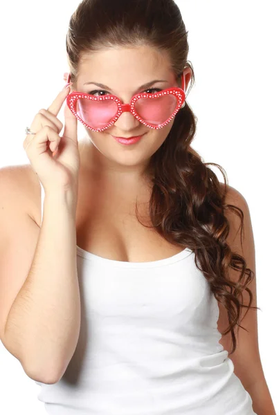 Young girl is holding red sunglasses — Stock Photo, Image